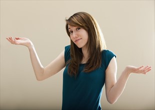 Studio portrait of young woman gesturing. Photo: Mike Kemp