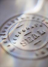 Close up of corporate seal on paper.