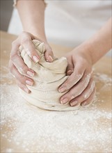 Woman preparing dough.