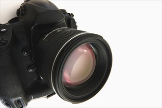 Close up of camera lens on white background.