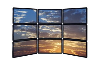 Close up of sky at sunset on monitors.
