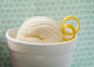 Close up of ice cream with lemon peel.