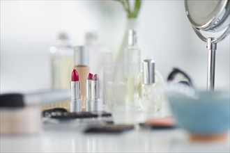 Make-up cosmetics on table.