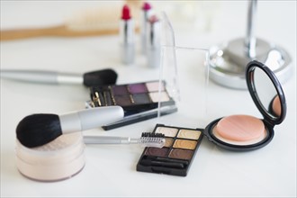 Make-up cosmetics on table.