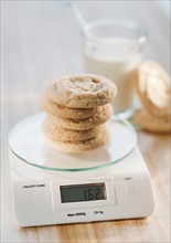 Stack of cookies on weight scale.