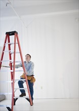 Worker climbing ladder. Photo: Jamie Grill Photography