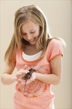 Girl (8-9) playing with mouse. Photo: Mike Kemp