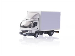 Delivery vehicle on white background. Photo : David Arky