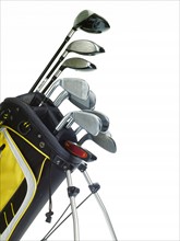 Golf bag with clubs on white background. Photo: David Arky