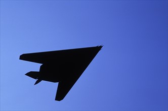 Silhouette of military plane flying against blue sky, Holland. Photo : Antonio M. Rosario