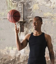 USA, Utah, Salt Lake City, Young man playing basketball. Photo: Mike Kemp