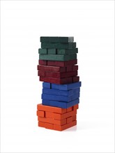 Studio shot of colorful wooden jenga blocks. Photo: David Arky