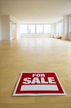For sale sign in empty room.