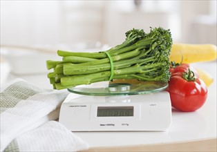 Fresh vegetables on weight scale.