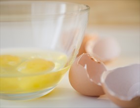Egg yolks in bowl and egg shell on side. Photo : Jamie Grill Photography