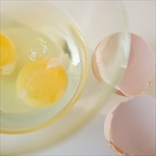 Egg yolks in bowl and egg shell on side. Photo : Jamie Grill Photography
