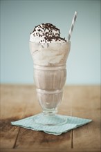 Close up of ice cream soda with chocolate chips.