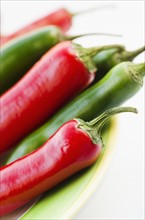 Studio shot of red and green Chili Peppers.