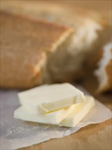 Slices of butter and fresh breadClose-up. Photo : Jamie Grill Photography