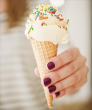 , female hand holding ice cream. Photo: Jamie Grill Photography