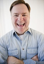 Portrait of man laughing. Photo: Jamie Grill Photography