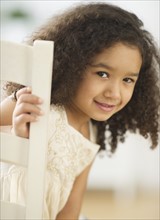 Portrait of smiling girl (6-7) with afro.