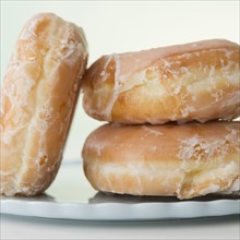 Glazed donuts, close-up. Photo : Jamie Grill Photography