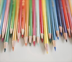 Studio shot of colored pencils in row. Photo: Jamie Grill Photography