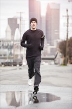USA, Washington, Seattle, man jogging. Photo: Take A Pix Media