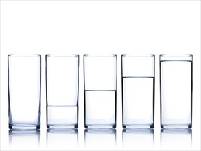 Studio shot of glasses of water in row. Photo : David Arky
