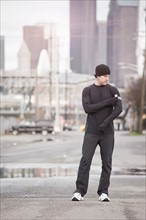 USA, Washington, Seattle, man in workout wear in street. Photo : Take A Pix Media