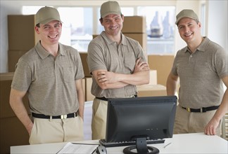 Three delivery warehouse workers.