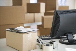 Boxes and computer at delivery warehouse.