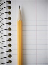 Close-up of pencil and notebook. Photo: Jamie Grill Photography