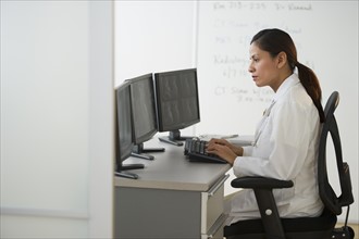 Female doctor making notes.