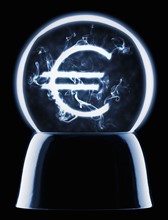 Studio shot of crystal ball showing euro symbol. Photo : Mike Kemp