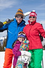 Grandparents with girl (10-11) posing during ski holiday. Photo : db2stock