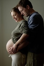 Studio shot of expectant couple. Photo : Rob Lewine