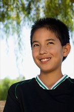 School boy (12-13) smiling. Photo : Noah Clayton
