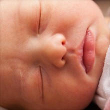 Baby girl (0-1 month) sleeping . Photo : Mike Kemp