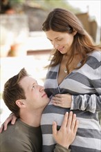 Portrait of expecting couple. Photo : Rob Lewine