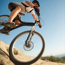 USA, California, Laguna Beach, Close up of mountain biker riding downhill.