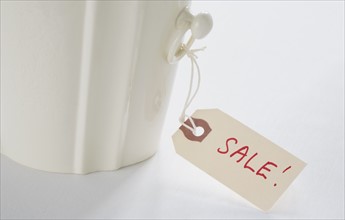 Close-up of label with "sale" sign. Photo : Chris Hackett