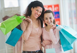 Mother with teenage girl (14-15) shopping.