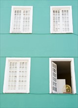 Brazil, Bahia, Salvador De Bahia, Facade of building with birdcage on open window. Photo : Jamie