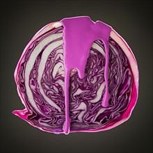 Studio shot of red cabbage covered with purple paint. Photo : Mike Kemp