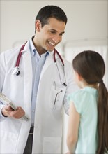 Doctor talking to girl (8-9).