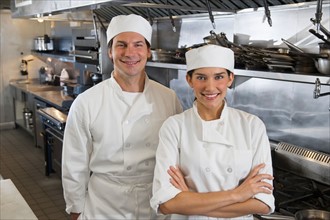 Chef and cook in commercial kitchen.
