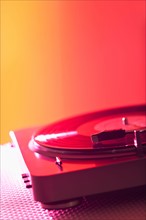 Close up of turntable on colored background. Photo : Daniel Grill