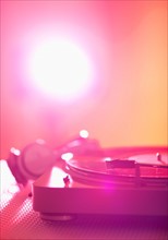 Close up of turntable on colored background. Photo : Daniel Grill